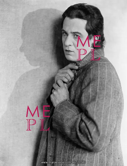 : Portrait of man holding coat closed : Portrait of man holding coat closed