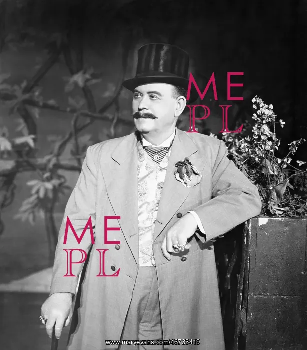 : Portrait of man leaning against a potted plant : Portrait of man leaning against a potted plant