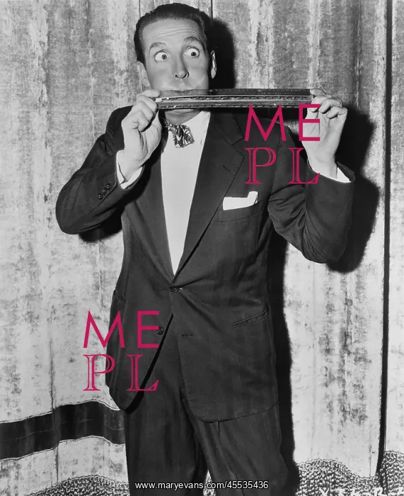 : Portrait of man playing huge harmonica : Portrait of man playing huge harmonica