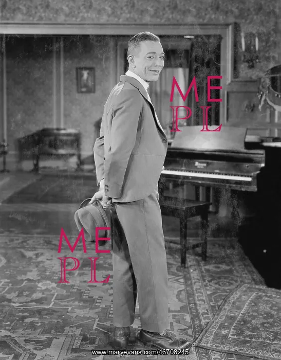 : Portrait of man in suit holding hat : Portrait of man in suit holding hat