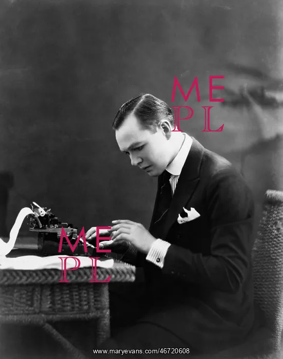 : Portrait of man using typewriter : Portrait of man using typewriter