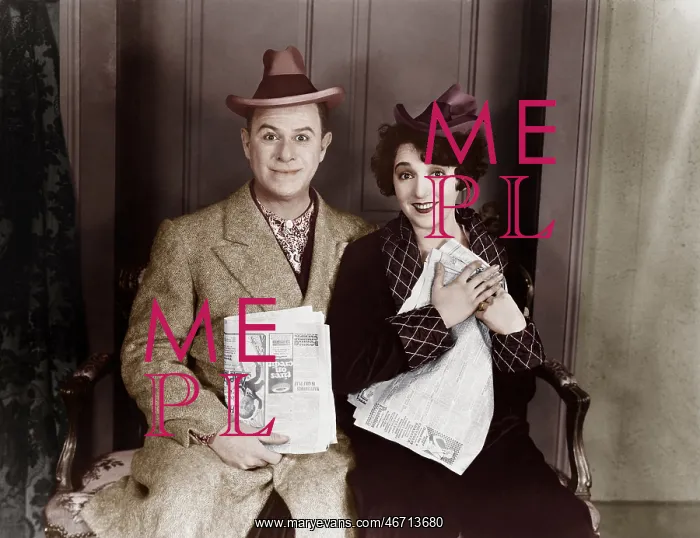  : Portrait of smiling couple with newspapers