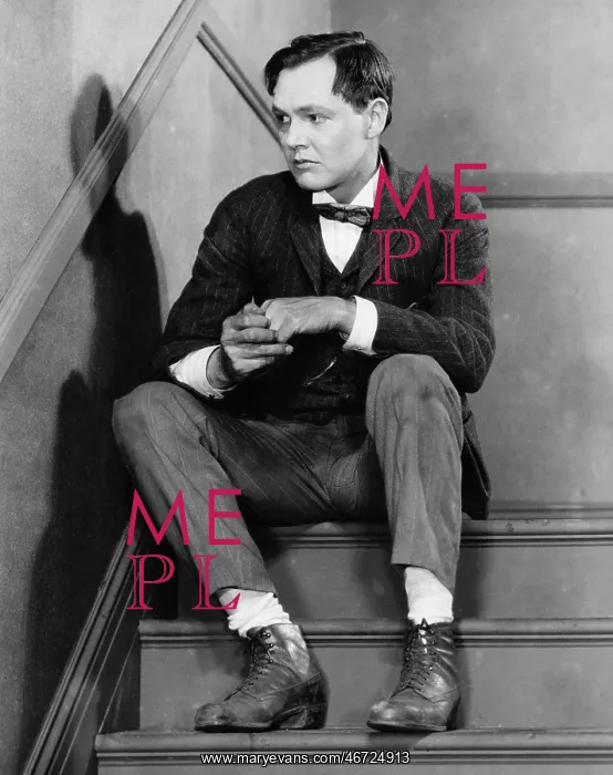 : Portrait of troubled man sitting on stairs : Portrait of troubled man sitting on stairs