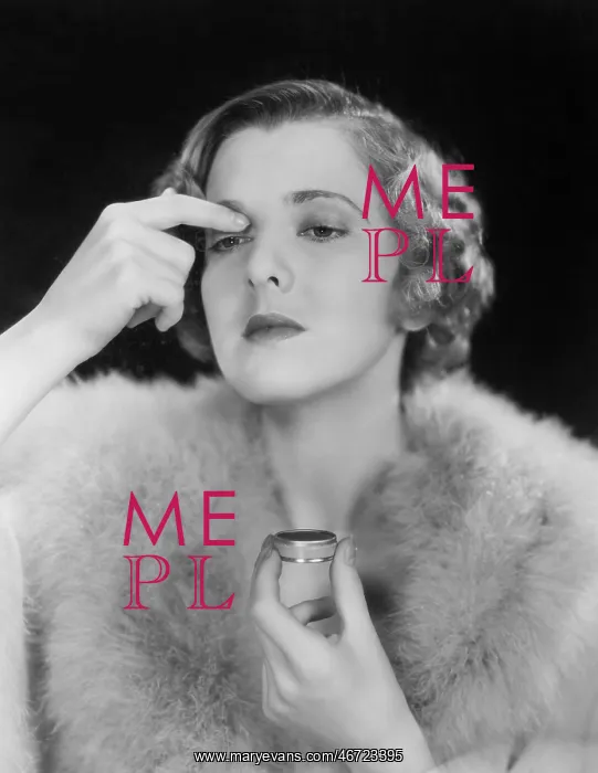  : Portrait of woman applying makeup