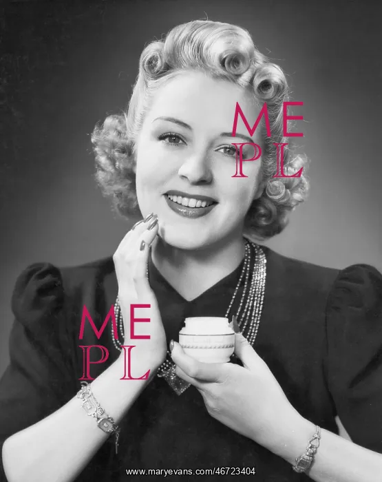  : Portrait of woman applying makeup