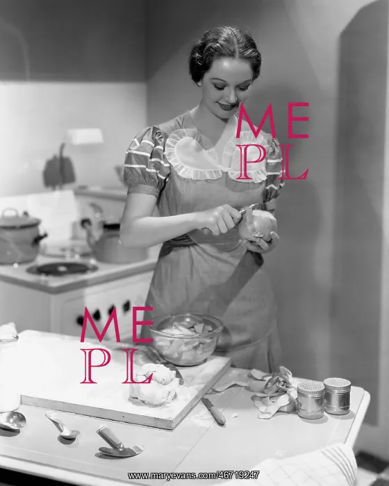 : Portrait of woman cooking in kitchen : Portrait of woman cooking in kitchen