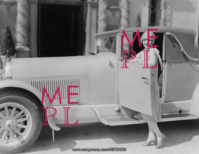 : Portrait of woman posing with car : Portrait of woman posing with car