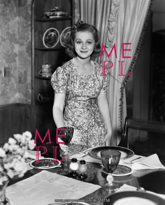 : Portrait of woman setting dining table : Portrait of woman setting dining table