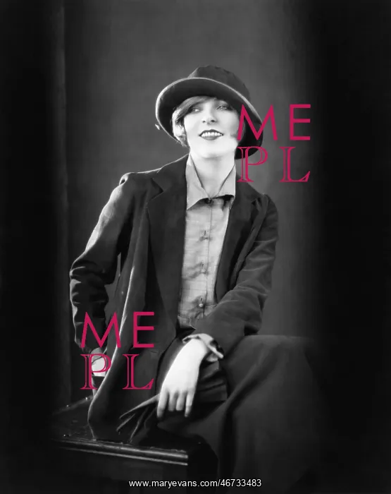 : Portrait of a woman sitting on a stool and smiling : Portrait of a woman sitting on a stool and smiling