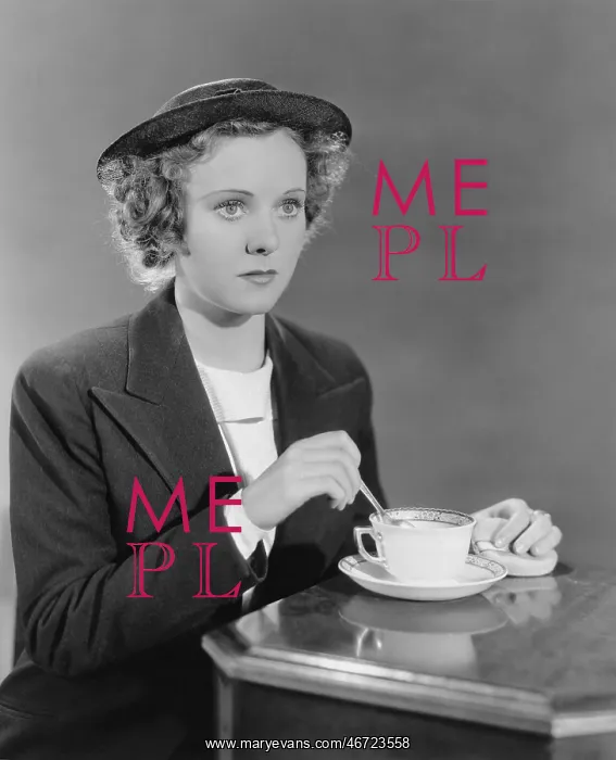 : Portrait of woman stirring beverage : Portrait of woman stirring beverage