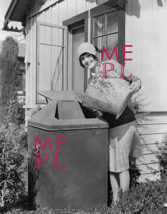 : Portrait of woman taking out trash : Portrait of woman taking out trash