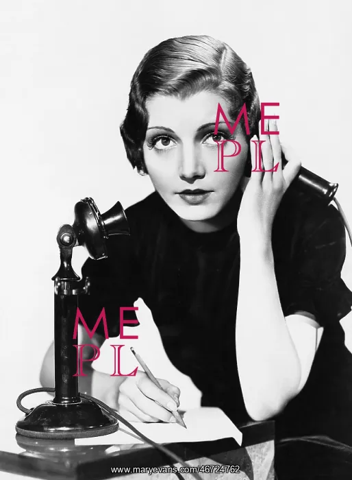 : Portrait of woman on telephone taking notes : Portrait of woman on telephone taking notes