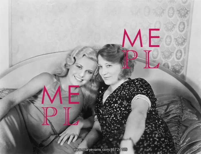 : Portrait of two women lying on a bed : Portrait of two women lying on a bed