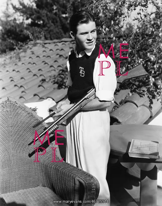 : Portrait of young man outside with gun : Portrait of young man outside with gun
