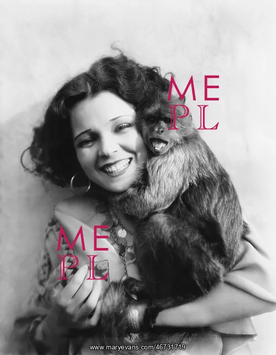 : Portrait of a young woman hugging her monkey : Portrait of a young woman hugging her monkey