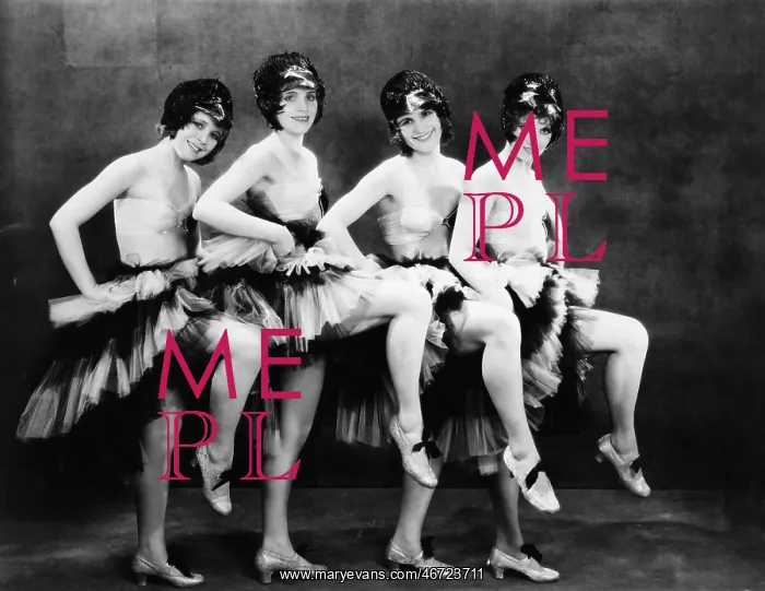 : Portrait of four young women performing a dance : Portrait of four young women performing a dance