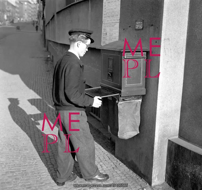 : Postman. Czechoslovakia - Prague, 1950. Mailman collects mail from mail box : Postman. Czechoslovakia - Prague, 1950. Mailman collects mail from mail box