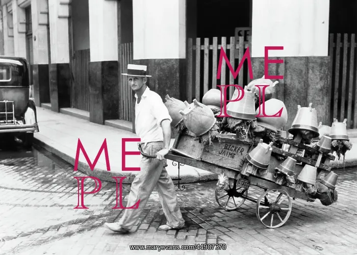 : Pot Salesman Looking at Camera Pulling his Cart Full of : Pot Salesman Looking at Camera Pulling his Cart Full of