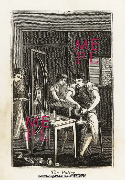 : Potter in apron shaping a clay bowl in a workshop : Potter in apron shaping a clay bowl in a workshop