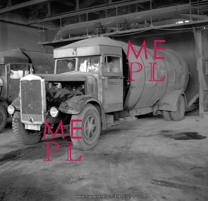 : Prague 1947, truck backs up and dumps trash in : Prague 1947, truck backs up and dumps trash in