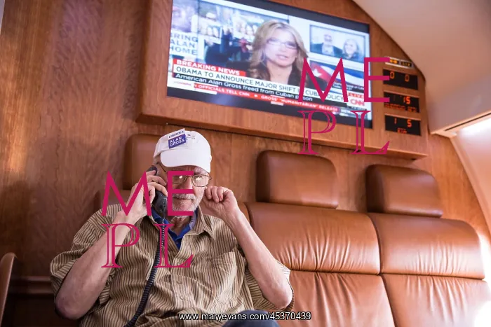  : President Barack Obama talks on the phone with Alan