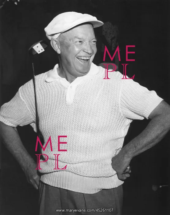 : President Dwight Eisenhower smiling while golfing : President Dwight Eisenhower smiling while golfing