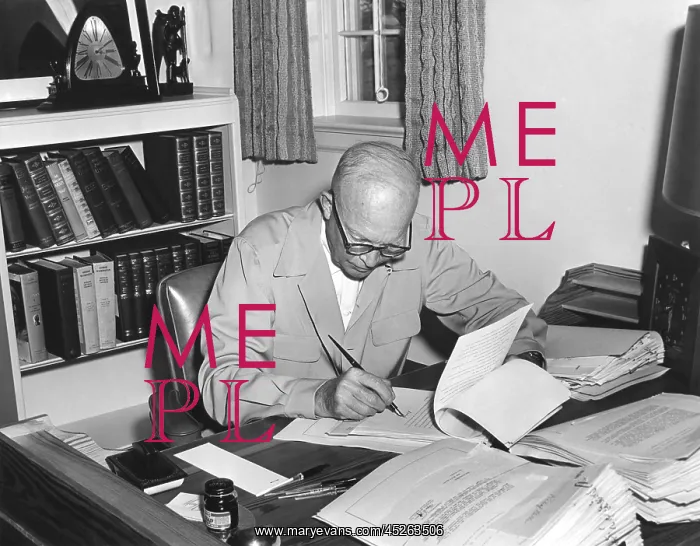 : President Eisenhower signs various bills at his : President Eisenhower signs various bills at his