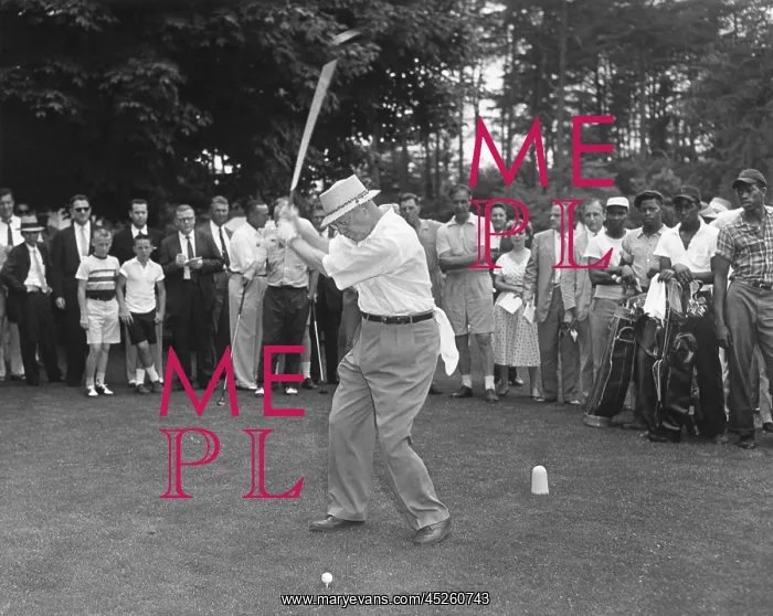 : President Eisenhower teeing off on a golf course : President Eisenhower teeing off on a golf course