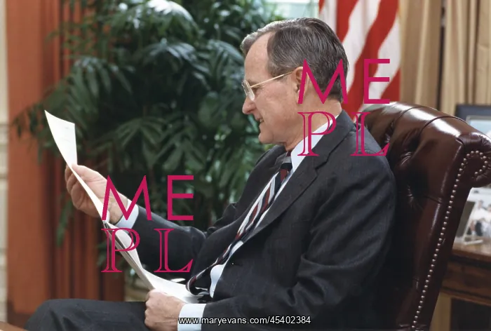 : President George H.W. Bush, reading a document : President George H.W. Bush, reading a document
