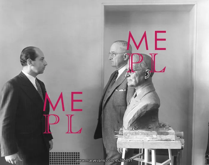 : President Harry Truman poses next to the bust : President Harry Truman poses next to the bust