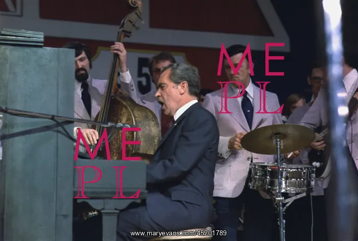 : President Nixon singing and playing the ? : President Nixon singing and playing the ?