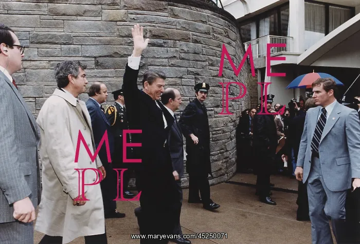 : President Reagan waving to crowds immediately : President Reagan waving to crowds immediately