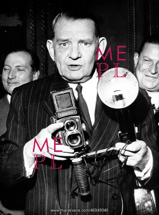 : President Rene Coty with a Rolleiflex camera : President Rene Coty with a Rolleiflex camera