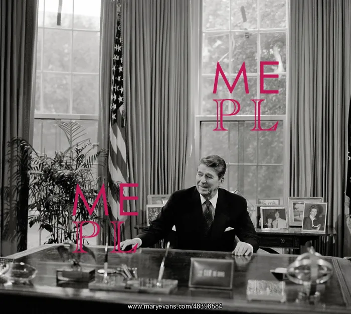  : President Ronald Reagan at his desk in the