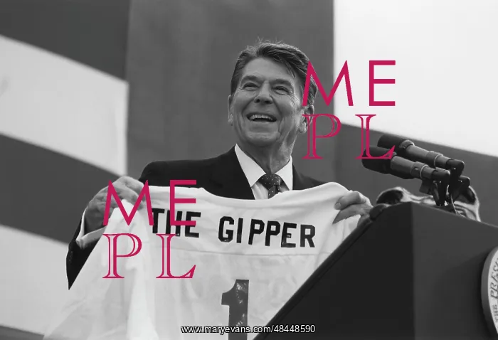 : President Ronald Reagan holding a jersey at : President Ronald Reagan holding a jersey at