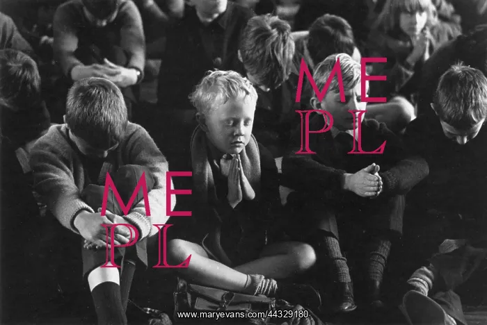 : Primary school children saying prayers during assembly : Primary school children saying prayers during assembly