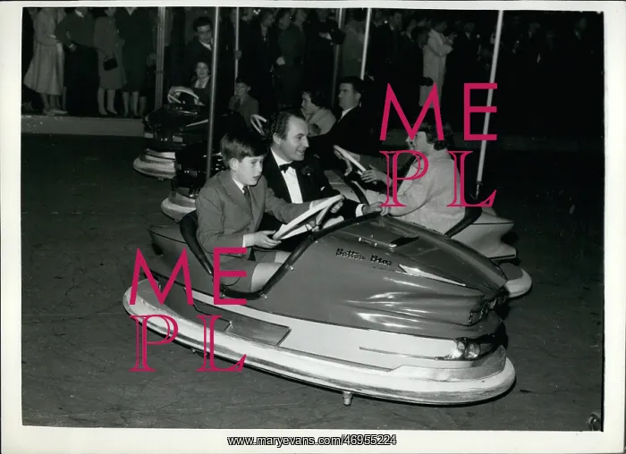 : Prince Charles in dodgem car at fun fair, Olympia, London : Prince Charles in dodgem car at fun fair, Olympia, London