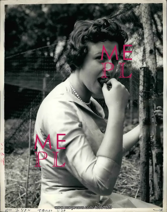 : Princess Alexandra eats a strawberry in her garden : Princess Alexandra eats a strawberry in her garden