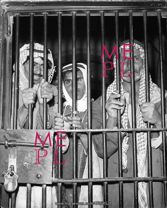 : Three prisoners behind bars in Iraq : Three prisoners behind bars in Iraq