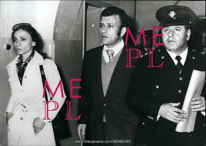 : Prisons. Mar. 22 Nickos Sampson and wife Vera by his side while being led : Prisons. Mar. 22 Nickos Sampson and wife Vera by his side while being led