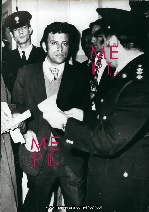 : Prisons. Mar. 03, 1976 - Nickos Sampson being escorted towards his prison cell in Leucosia : Prisons. Mar. 03, 1976 - Nickos Sampson being escorted towards his prison cell in Leucosia