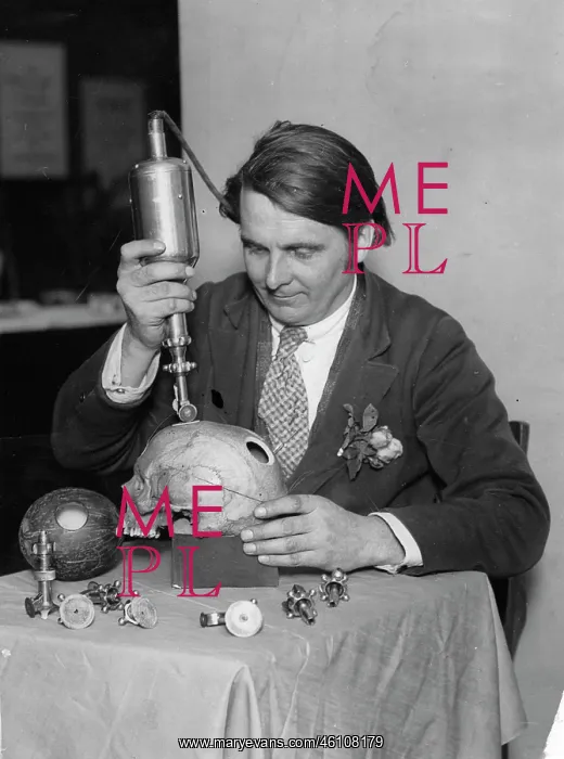 : Professor Williams with trepanning machine : Professor Williams with trepanning machine