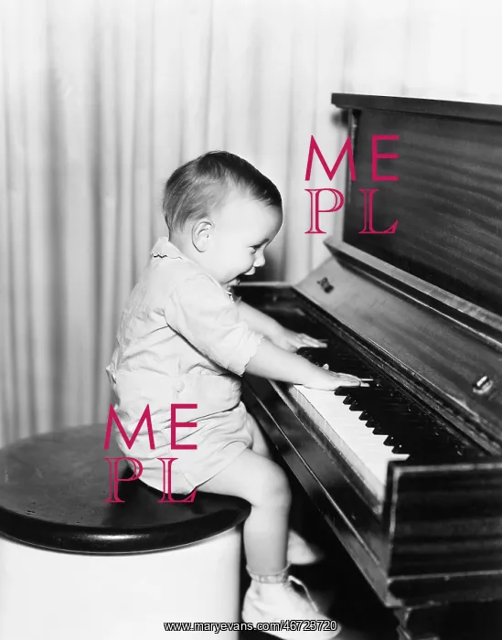 : Profile of a little boy sitting on a stool and playing : Profile of a little boy sitting on a stool and playing