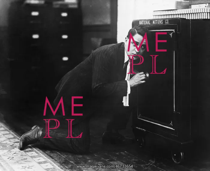 : Profile of a man opening the door of a safe : Profile of a man opening the door of a safe