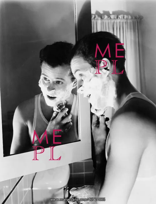 : Profile of a young man in front of a mirror in a : Profile of a young man in front of a mirror in a