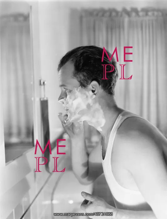 : Profile of a young man in front of a mirror in a : Profile of a young man in front of a mirror in a
