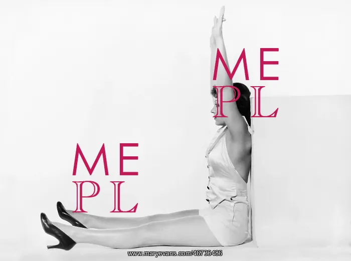 : Profile of a young woman exercising against a cube : Profile of a young woman exercising against a cube