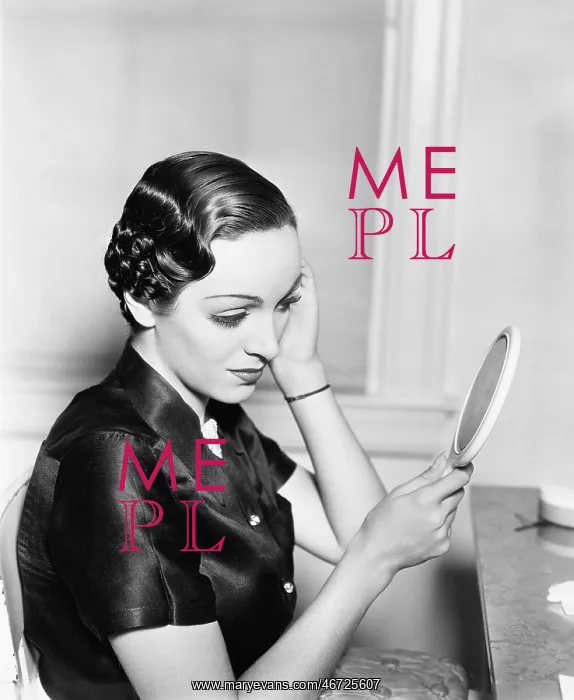 : Profile of a young woman looking into a mirror checking : Profile of a young woman looking into a mirror checking