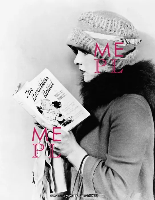: Profile of a young woman reading a book : Profile of a young woman reading a book