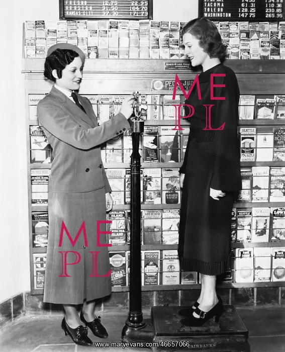 : Profile of a young woman in an uniform measuring : Profile of a young woman in an uniform measuring